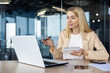 © Tetiana - Professional woman giving a presentation in modern office