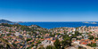 Summer view of Marseille overlooking rooftops with Mediterranean Sea (Bompard neighborhood). Bouches-du-Rhone, Provence-Alpes-Cote d'Azur, France