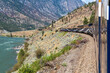 Rocky Mountaineer train along Fraser River, British Columbia, Canada.