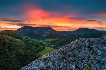 Sticker - Colorful sky, fantastic evening.  Picturesque and gorgeous evening scene on a rock overlooking the hills.. Beauty world.