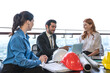 © Jack Tamrong - Business develop man discuss and brainstorming with young architect women about big construction project