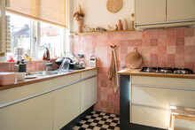 Cozy Kitchen Interior With Vintage Pink Tiles And Natural Light.
