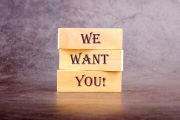 We want you written on wooden blocks on a dark background