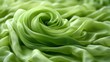A close up of a green rose on top of some fabric, AI