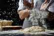 A chef is making bread dough and it is very messy. The dough is being thrown into the air and the chef is covered in flour