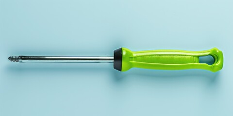 Poster - A green screwdriver placed on a blue background. Suitable for construction and DIY projects