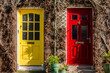 Two residential front doors, one yellow, one red. Colorful doors in Ireland