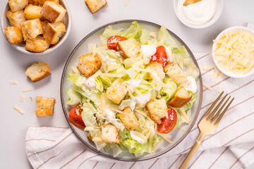 Wall Mural - Caesar Salad with Lettuce, Cheese, Cherry Tomatoes and Croutons