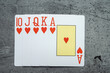 Hearts royal flush poker combination on grey background