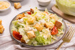 Caesar Salad with Lettuce, Cheese, Cherry Tomatoes and Croutons