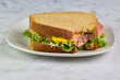 bologna sandwich  with mustard and lettuce