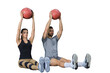 Fit and muscular couple exercising with medicine ball on a transparent background