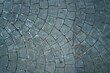 Cobblestone pattern of the sidewalk pavement from above as background and urban street texture