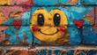 Yellow smiley face painted on an old wall in graffiti style.