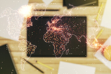 Wall Mural - multi exposure of abstract graphic world map and modern digital tablet on desktop on background, top