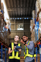 Warehouse worker working in warehouse storage. Foreman or worker work at factory site check up products in site. Inventory worker working in  factory Storehouse