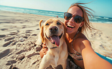 selfie portrait of a beautiful woman with her retriever dog on the beach by the sea, while traveling