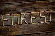 Fire concept with forest text on wooden background top view