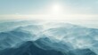   A panorama of mountains with a radiant sun atop in the distance