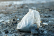 Closeup of a plastic bag on the ground. Pollution Concept