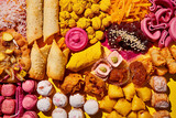 Fototapeta Most - A meticulously arranged platter of Indian street food, featuring a colorful assortment of chaat, samosas, and sweets, the textures.
