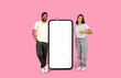 © Prostock-studio - Couple interacting with a big phone screen mockup
