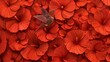   A hummingbird perches atop a mass of orange petunias; their red petals form a backdrop