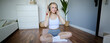 Portrait of happy, beautiful athletic woman, working out at home, listening music to boost energy while active training session, using wireless headphones and rubber yoga mat