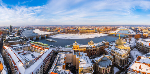 Wall Mural - The Dresden and Elbe river cityscape covered in snow on a cold winter day in late afternoon.