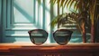 a pair of sunglasses sitting on top of a wooden table next to a plant and a window