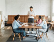 © Lumos sp - young business people meeting office teamwork group presentation seminar man businessman startup project interior training student education leader explaining