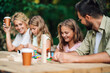 © Zamrznuti tonovi - Fun family is playing wooden block game in nature.