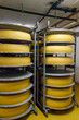 Cheese dairy plant warehouse with shelves stacked with cheese