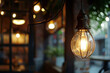 A light bulb is lit up in a dimly lit room. The light is warm and inviting, creating a cozy atmosphere