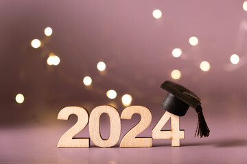 Wall Mural - Number 2024 with graduated cap and bokeh lights. Class of 2024 concept