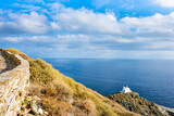 Fototapeta  - View of small Greek chapel church against blue sea in Kastro village, Sifnos island, Greece
