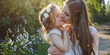 © britaseifert - Mother and daughter bonding. Loving family connection, parent-child closeness. Cute little preschooler daughter hug cuddle with smiling young mother kiss