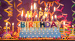 Lit candles of different colors in the shape of letters forming the phrase HAPPY BIRTHDAY, against a purple out-of-focus background