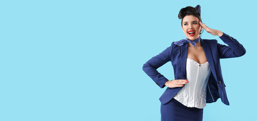 Poster - Attractive pin-up stewardess saluting on blue background