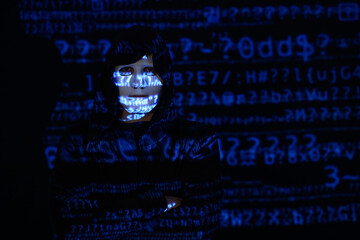 Wall Mural - Hacker with projection of programming code on dark background