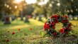Floral wreath on grave at sunset in tranquil cemetery