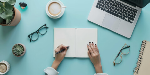 Wall Mural - top view white book and accounting on a minimal clean light blue desk with laptop