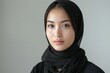 © Space Priest - A woman wearing a black scarf and a black head scarf