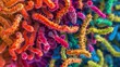 A vibrant bacterial colony resembling a colorful abstract painting with hundreds of tiny rodshaped cells tightly packed together and