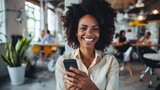 Fototapeta Londyn - Portrait happy young african businesswoman using smartphone in the office