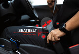Fototapeta  - Close-up hand man driver fastens seat belt.