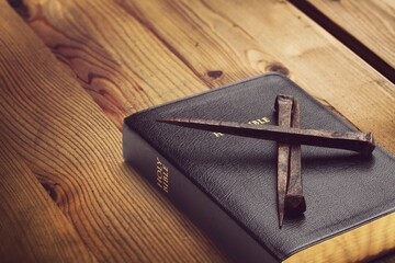 Wall Mural - Holy Bible book, cross on light background