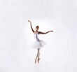 © Acronym - Ballet dancer isolated on white. Beautiful ballerina performing in studio.