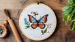 Handcrafted Butterfly Cross Stitch Embroidery, Needle and Thread on Wooden Table, Artistic Craftsmanship, Home Hobby