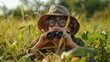young explorer, binoculars in hand, donned in safari attire, lies amidst green, eager for discovery, AI Generative